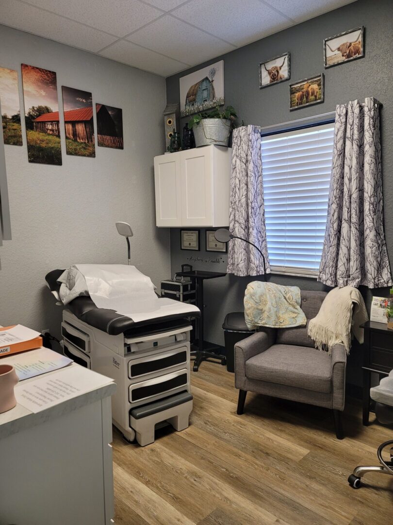 A room with a couch, chair and a table.