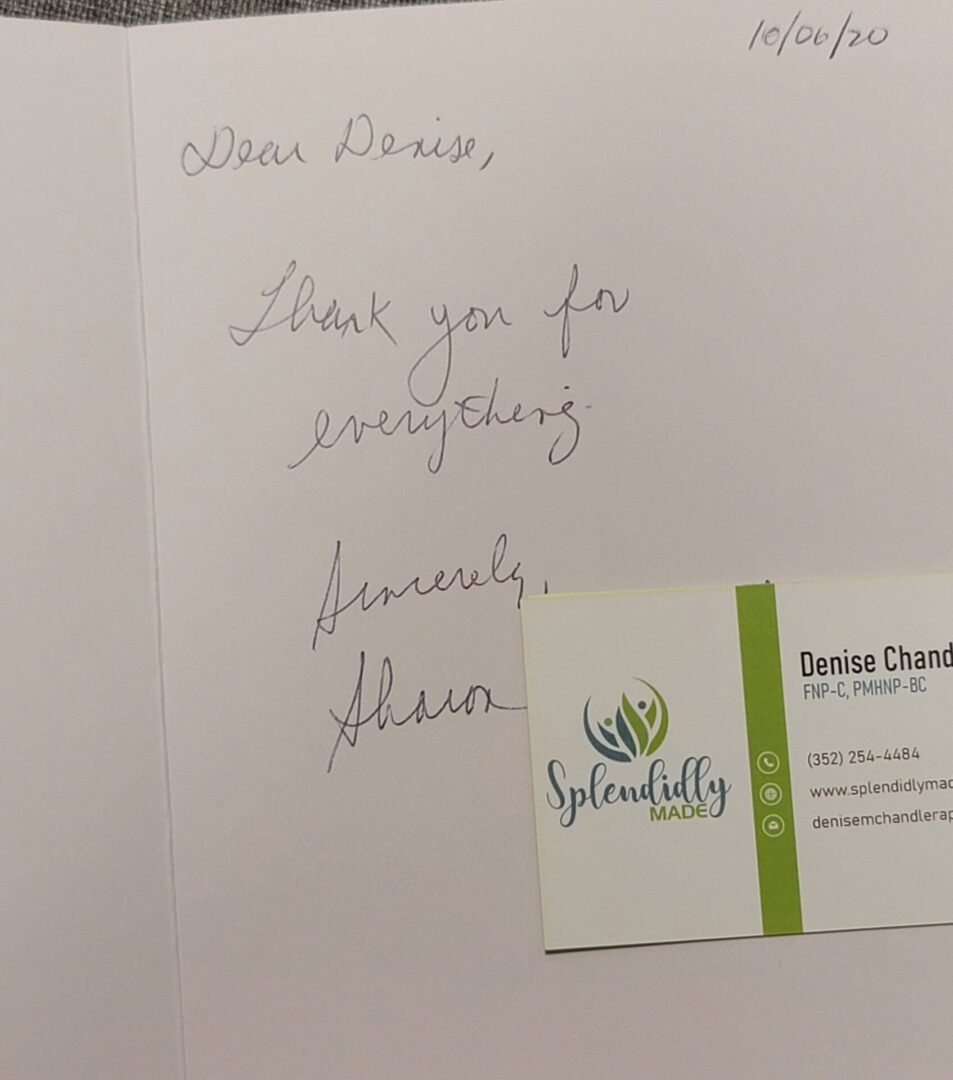 A note and business card are written in cursive.