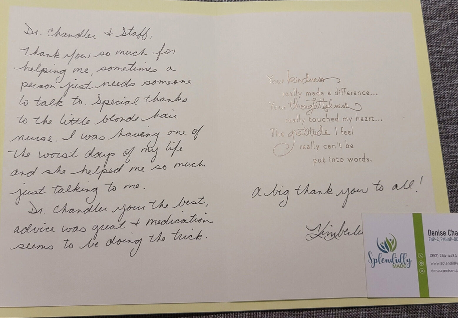 A card with handwritten notes and a picture of the back.